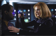 Dr. Crusher is examining Geordi's eyes